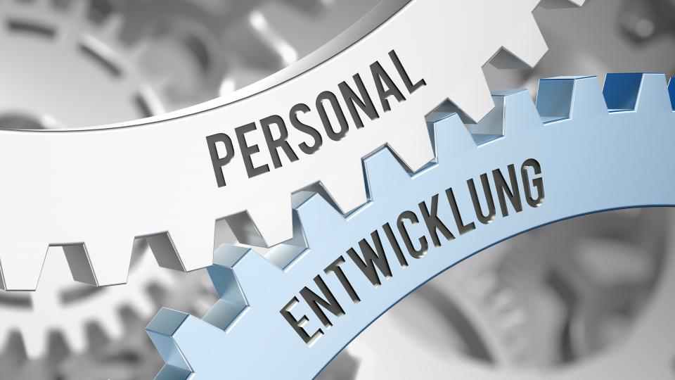 ineinandergreifende Zahnräder für Personal und Etnwicklung